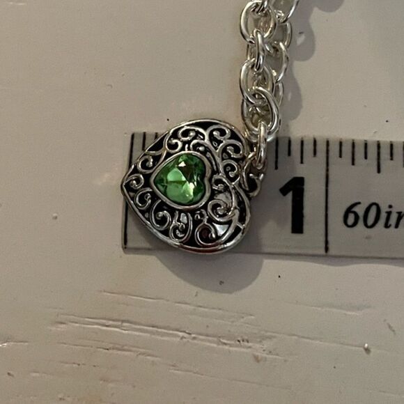 7” silver tone rolo chain bracelet w/0.75” filigree heart w/peridot center - Picture 9 of 9